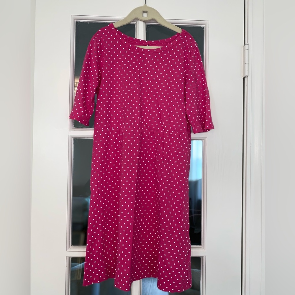 Pink knee length tshirt dress with white polka dots